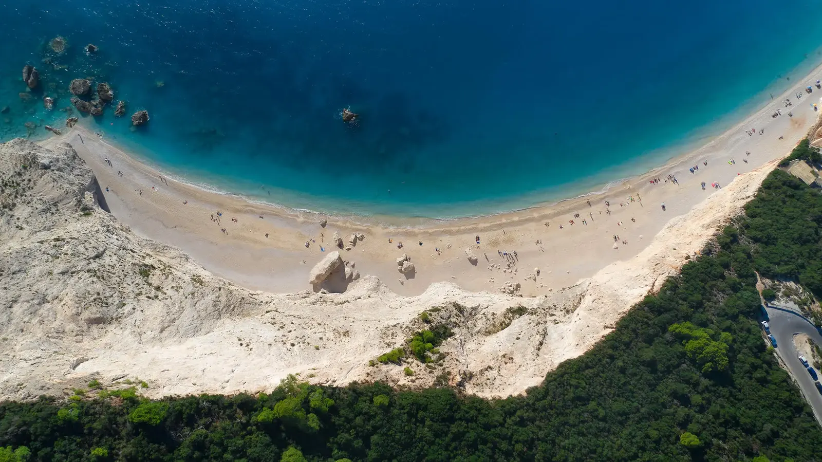 A white pebble beach and turquoise sea on Lefkada